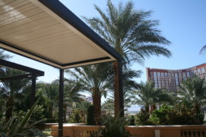 An image of a louvered patio providing shade for a hotel from Apollo Opening Roof