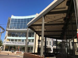 A restaurant patio covered by a louvered roof done by Apollo