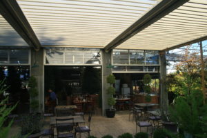An image of a covered restaurant patio done by Apollo