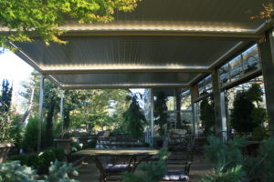 A louvered patio for a restaurant done by Apollo Opening Roofs
