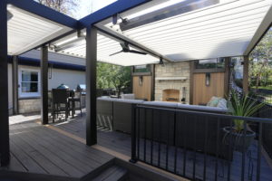 Comfortable outdoor living space from a louvered patio done by Apollo Opening Roof