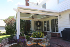 An image of a residential patio covered by Apollo's louvered roof