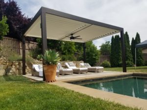 An image of a residential louvered roof by a pool, done by Apollo Opening Roof