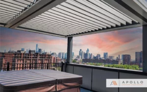 Motorized pergola on a New Jersey rooftop overlooking the skyline, providing cover for a spa.