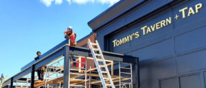 Breslow Home Design's install team installing a louvered pergola at Tommy's Tavern + Tap in NJ.