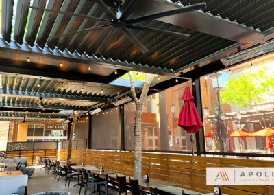 Image of an adjustable louvered pergola providing shade and a comfortable outdoor dining experience at the Back Bistro restaurant.