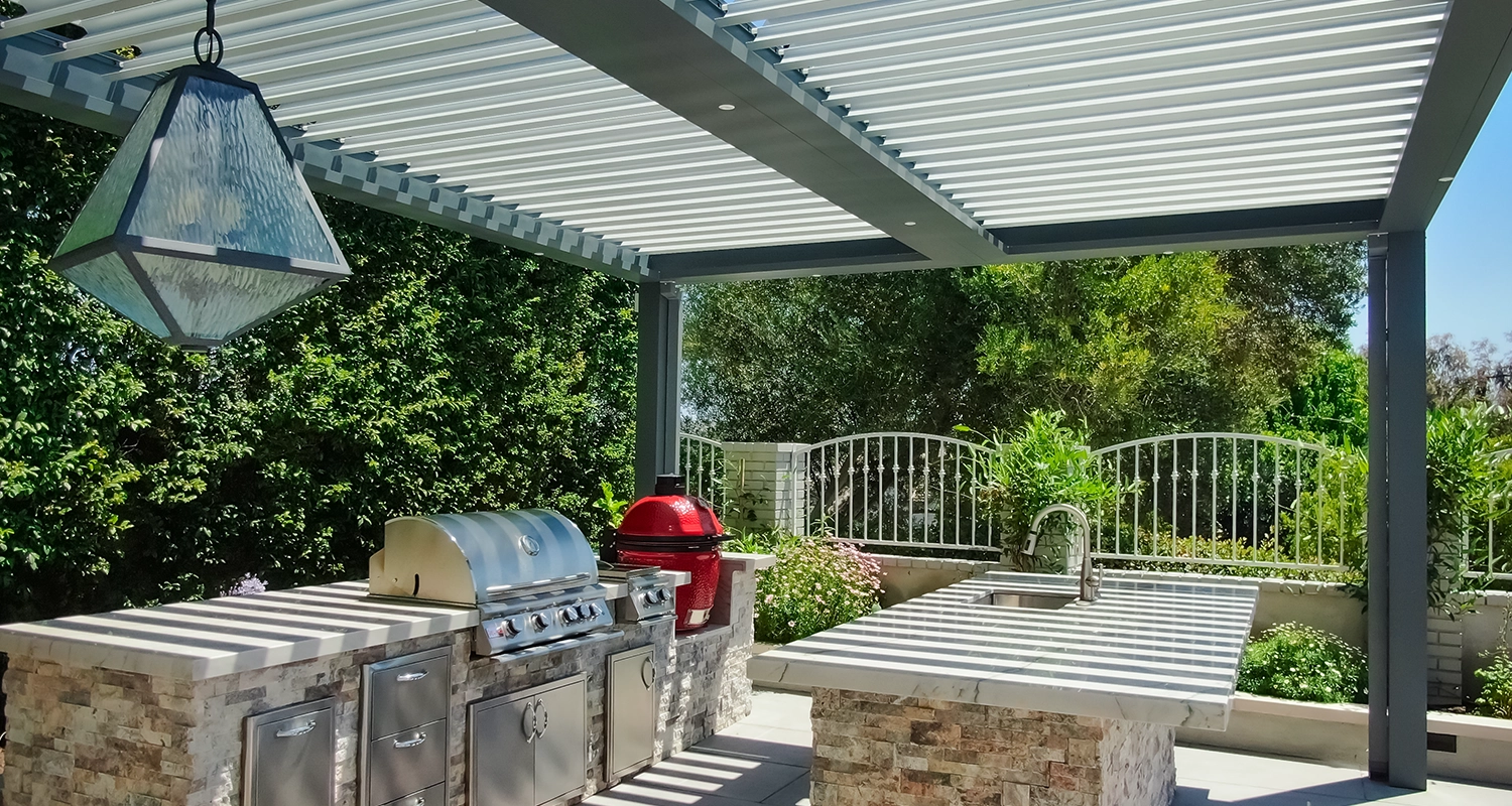 Louvered roof over outdoor kitchen. All weather solution to utilizing outdoor spaces year-round.
