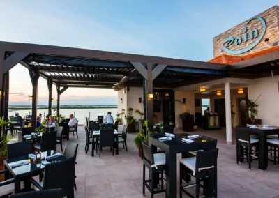 Louvered patio cover at Rain Restaurant, San Pedro Belize, providing ultimate outdoor dining comfort.