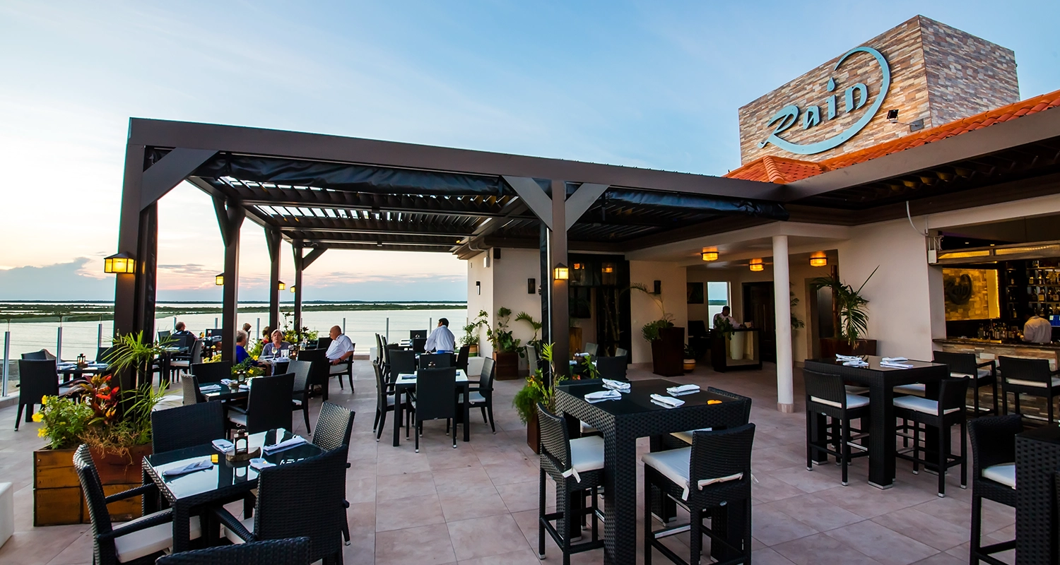 Louvered patio cover at Rain Restaurant, San Pedro Belize, providing ultimate outdoor dining comfort.