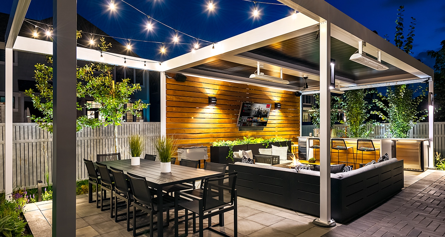 Luxurious louvered pergola creating a backyard oasis with entertainment area and ambient night lights