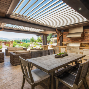 Apollo louvered roof seamlessly integrated into wood panel roofing creating a beautiful rustic modern outdoor space.