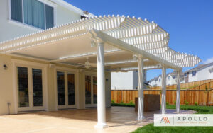 Elegant residential integrated louvered roof with custom framing and unique lattice tube cover.