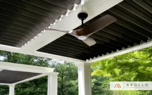 Two multi-bay aluminum pergolas with light framing, bronze louvers, and custom wood fans.