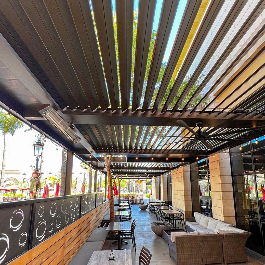 Apollo technicians working on a louvered pergola installation at Tommy's Tavern.