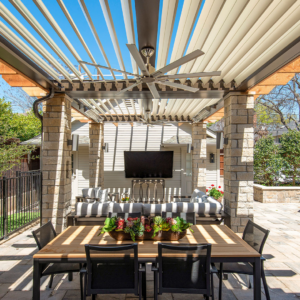 Bright and airy outdoor patio enhanced by a louvered pergola system with open slats.