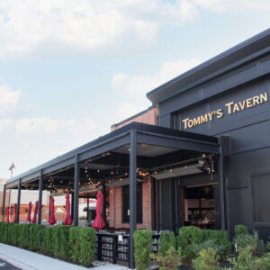 Tommy's Tavern outdoor dining area with Apollo's commercial pergola providing shade and style.