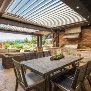Custom louvered roof pergola integrated with an outdoor kitchen