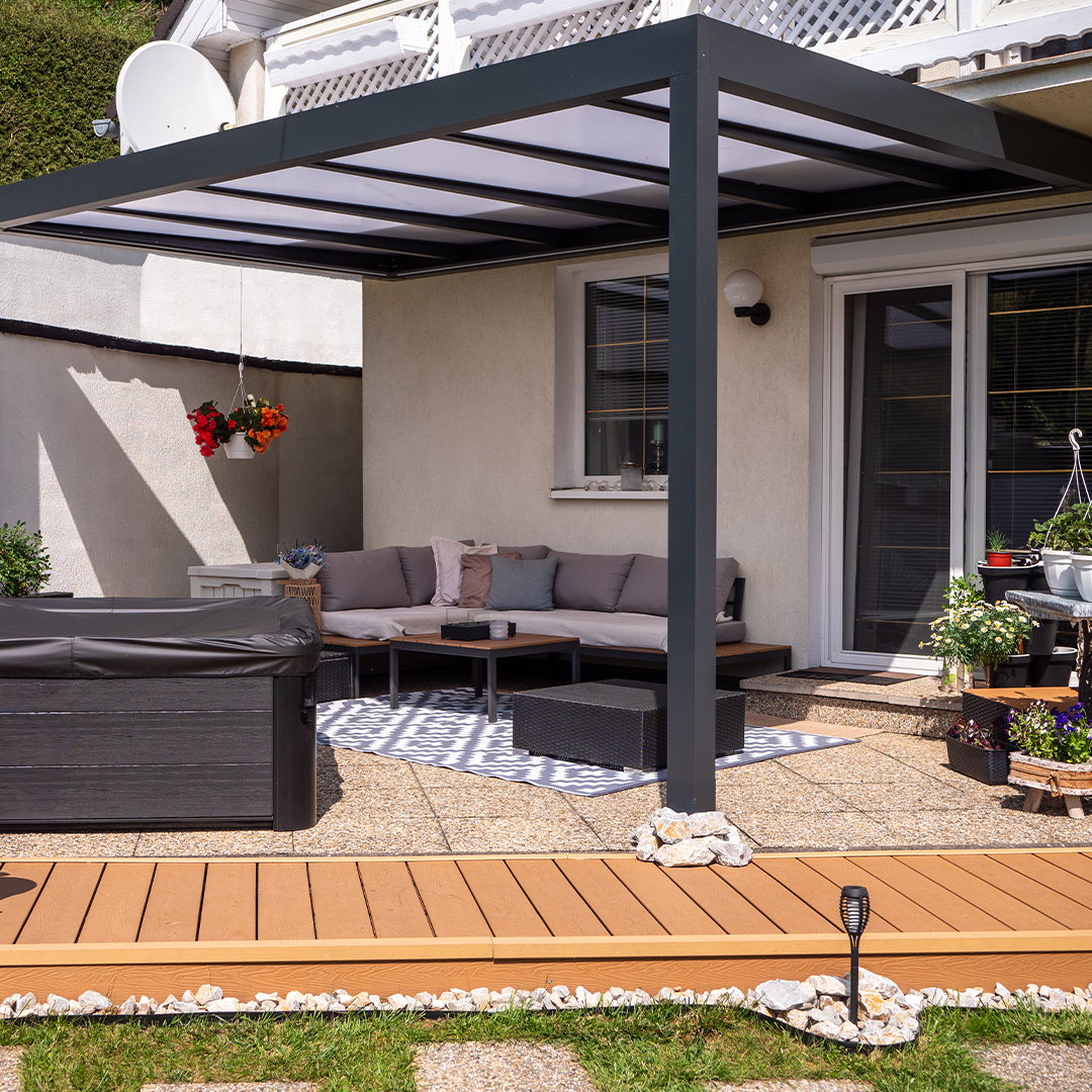 Covered patio with modern pergola and gray outdoor lounge set