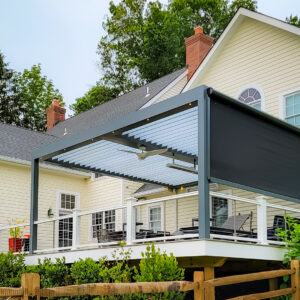 Elevated deck with louvered pergola, ceiling fan, and retractable screen