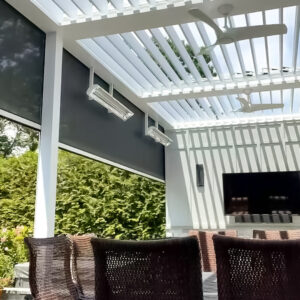 Outdoor living room with louvered roof, ceiling fans, and mounted TV