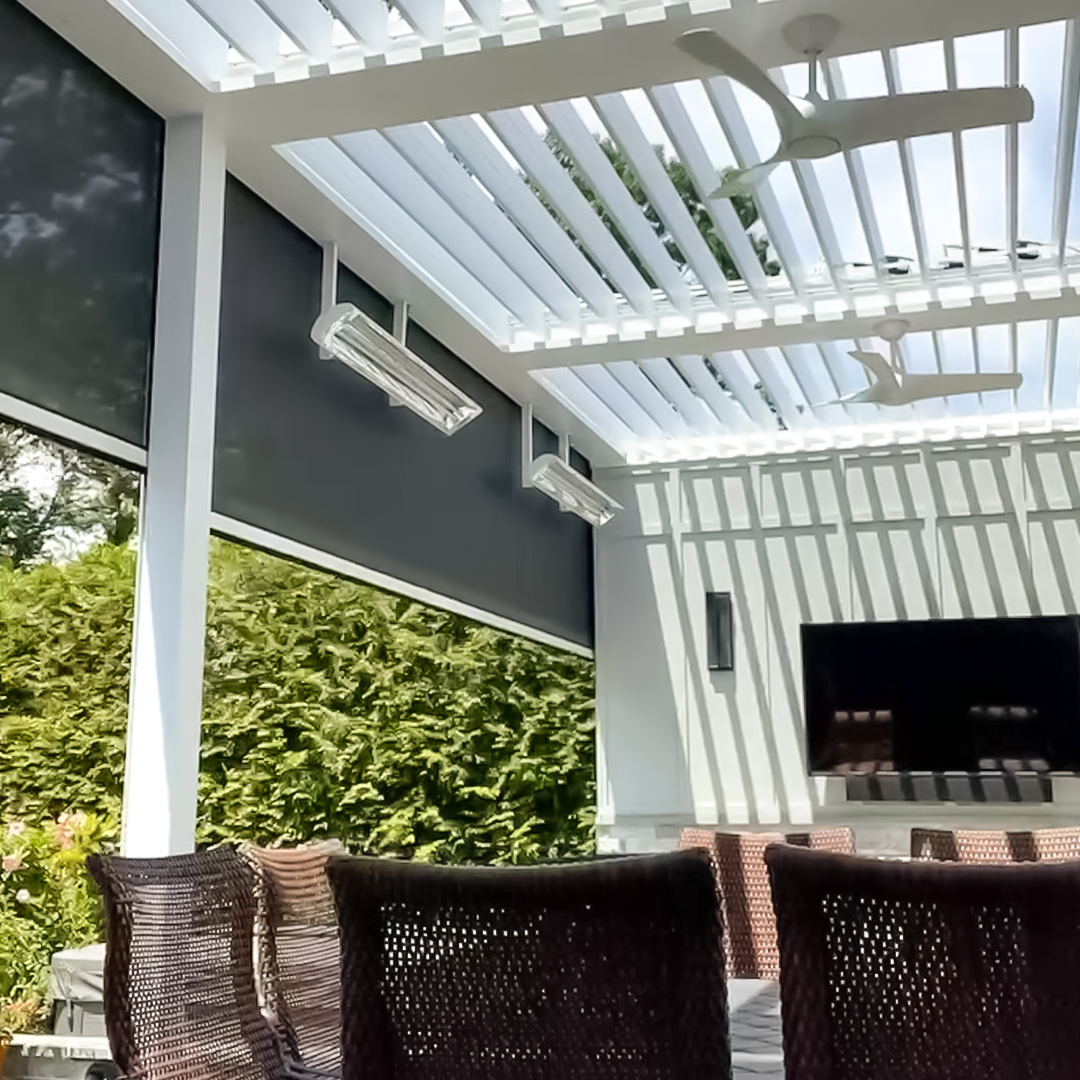 Outdoor Living Room with Louvered Roof Outdoor living room with louvered roof, ceiling fans, and mounted TV