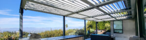 Panoramic view of outdoor patio with louvered roof and modern seating area