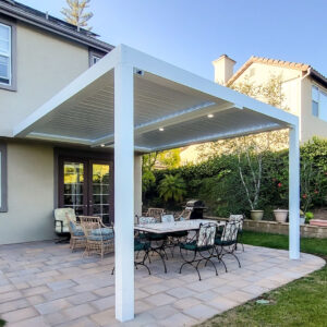 Louvered patio cover structure with seating and dining area