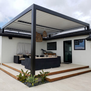 Modern aluminum pergola covering a contemporary outdoor patio with seating