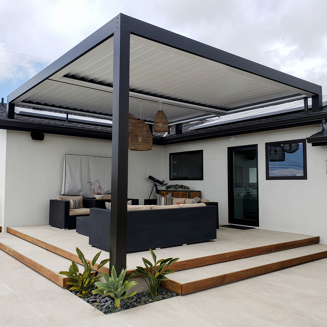 Modern aluminum pergola covering a contemporary outdoor patio with seating
