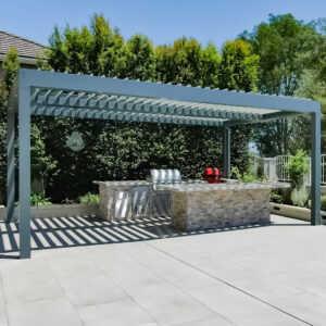 Freestanding louvered pergola covering an outdoor kitchen patio in Laguna Niguel