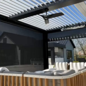 Open aluminum louvered pergola with ceiling fan and motorized privacy screens over an outdoor lounge area